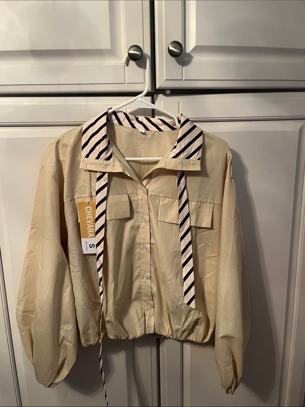 Chevvara Beige Buttoned Crop jacket  with Striped Tie Collar